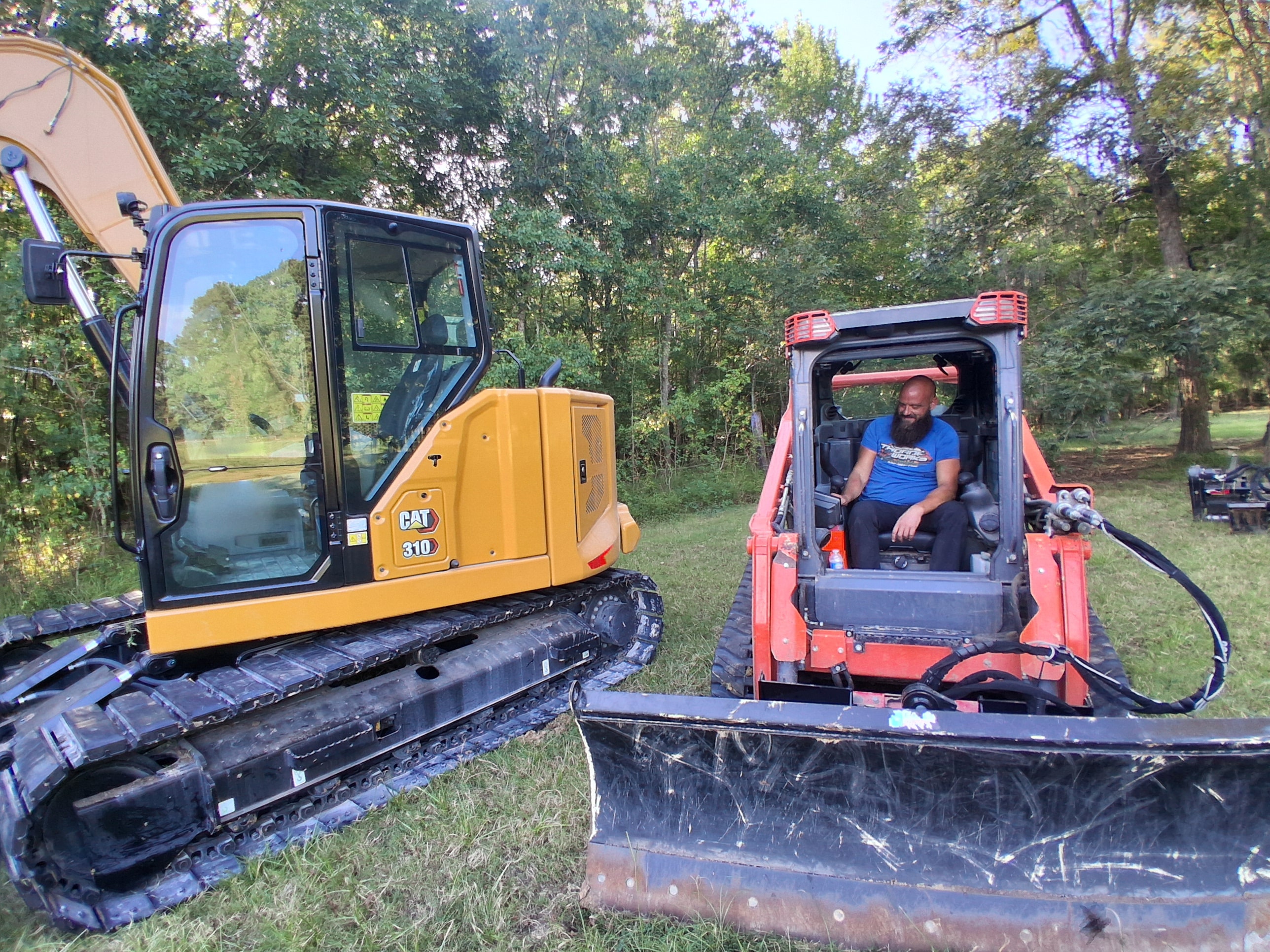 Erik Thorne operating the CAT 310 excavator and skid steer on a Texas job site